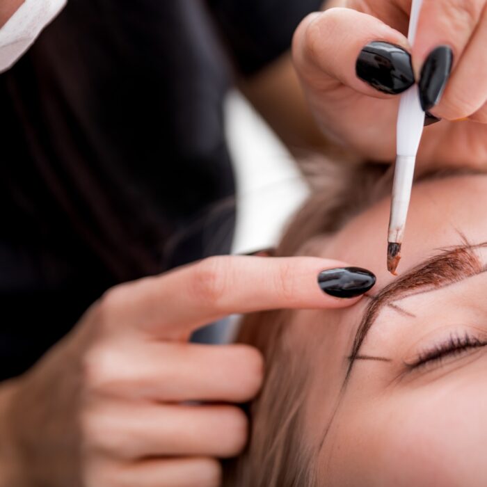 Permanent make up on eyebrows at beauty salon